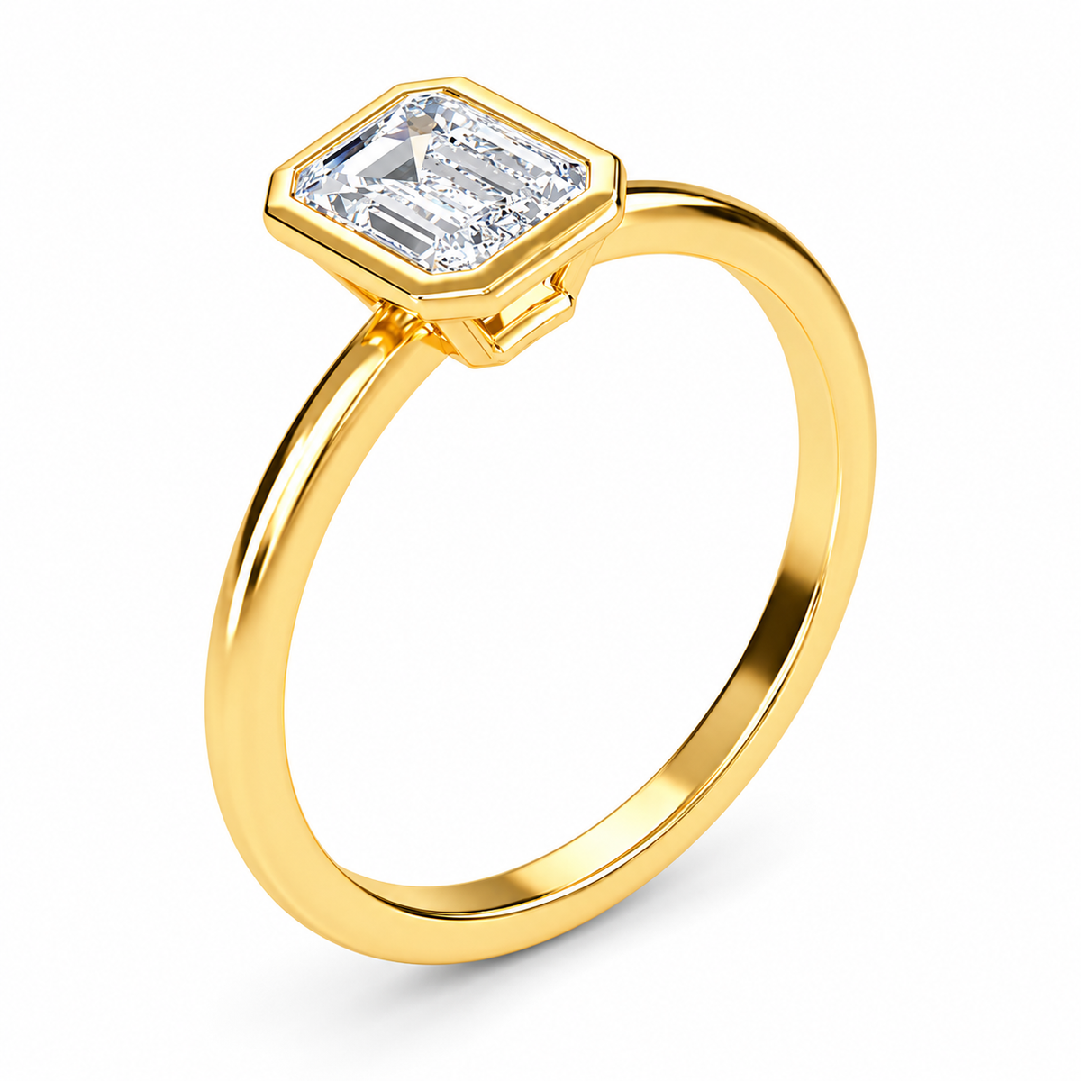 Angled view of an emerald-cut lab-grown diamond bezel-set solitaire engagement ring in yellow gold