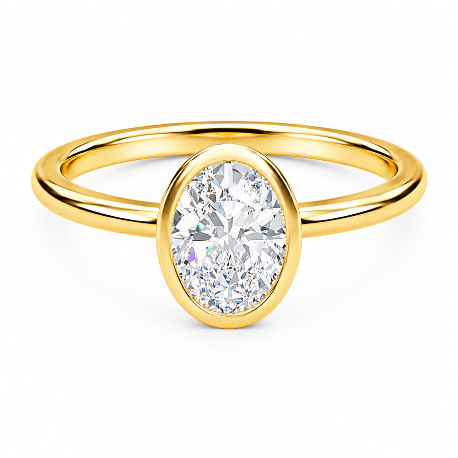 Front view of an oval-cut lab-grown diamond bezel-set solitaire engagement ring in yellow gold