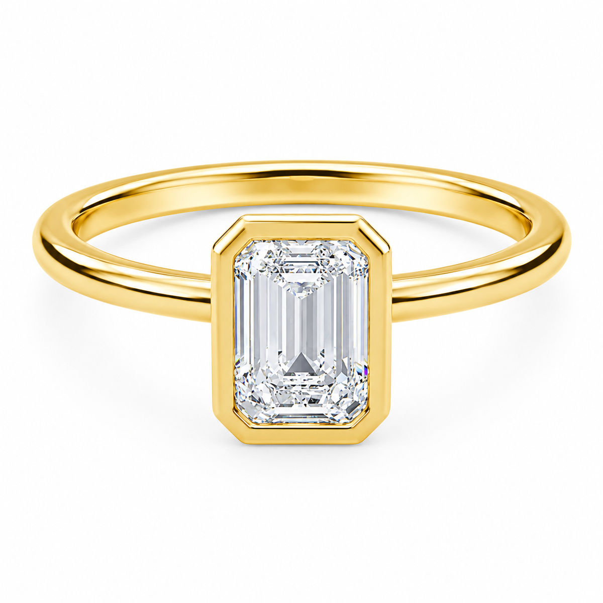 Front view of an emerald-cut lab-grown diamond bezel-set solitaire engagement ring in yellow gold