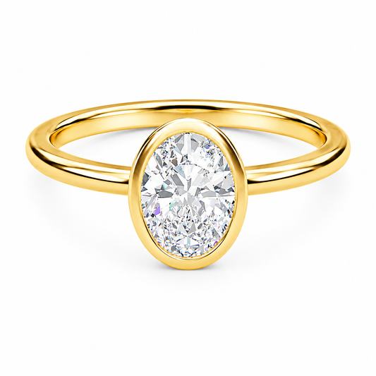 Front view of an oval-cut lab-grown diamond bezel-set solitaire engagement ring in yellow gold