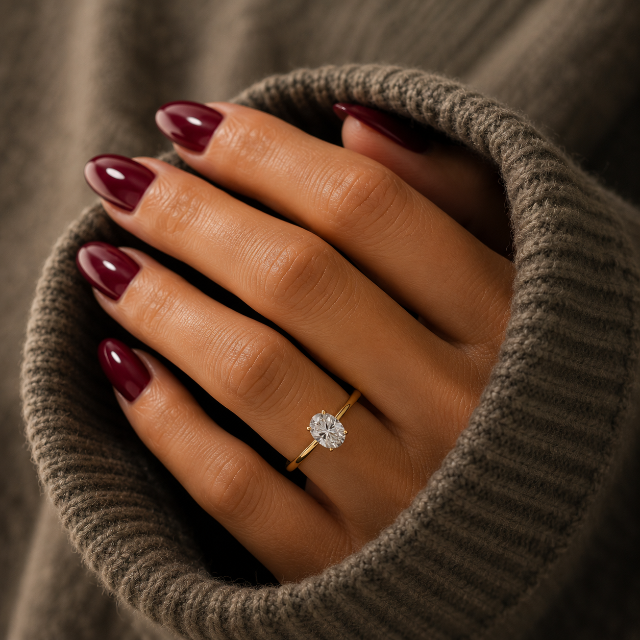 Oval-cut lab-grown diamond cathedral solitaire engagement ring lifestyle close-up