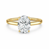 Front view of an oval-cut lab-grown diamond cathedral solitaire engagement ring in yellow gold