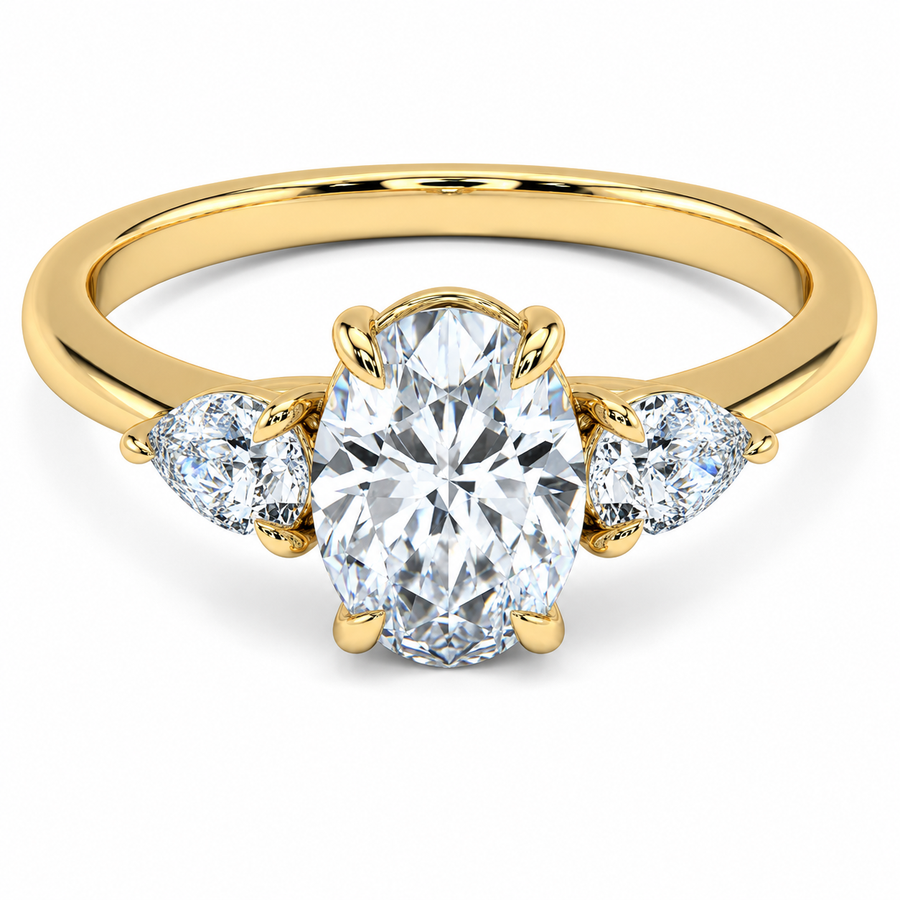 Front view of an oval-cut lab-grown diamond trilogy engagement ring in yellow gold