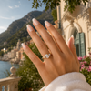 Oval-cut lab-grown diamond trilogy engagement ring worn on hand