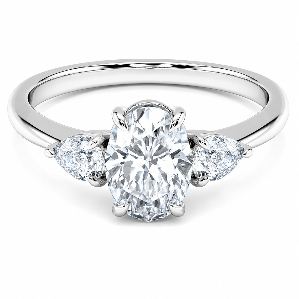 Front view of an oval-cut lab-grown diamond trilogy engagement ring in white gold