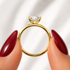 Side profile of a radiant-cut lab-grown diamond solitaire engagement ring in yellow gold