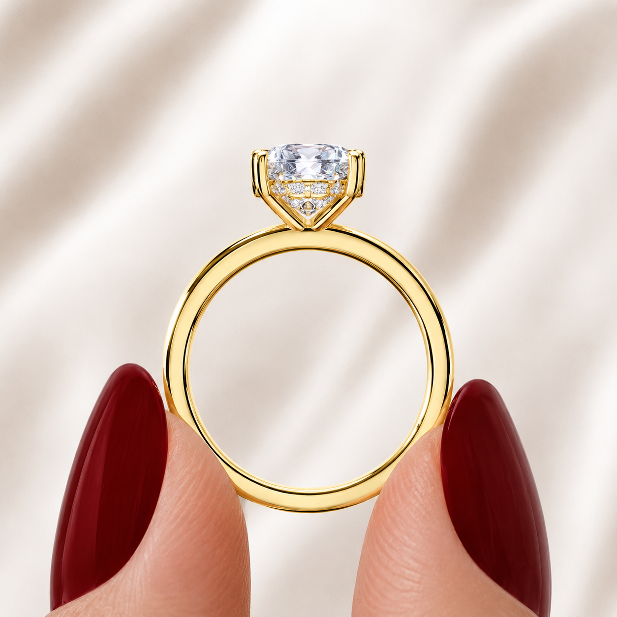 Side profile of a cushion-cut lab-grown diamond hidden halo engagement ring in yellow gold