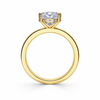 Angled view of a cushion-cut lab-grown diamond hidden halo engagement ring in yellow gold