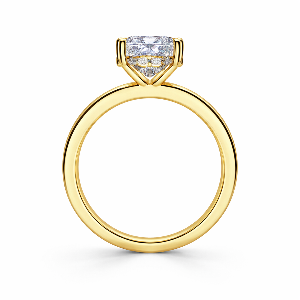Angled view of a cushion-cut lab-grown diamond hidden halo engagement ring in yellow gold