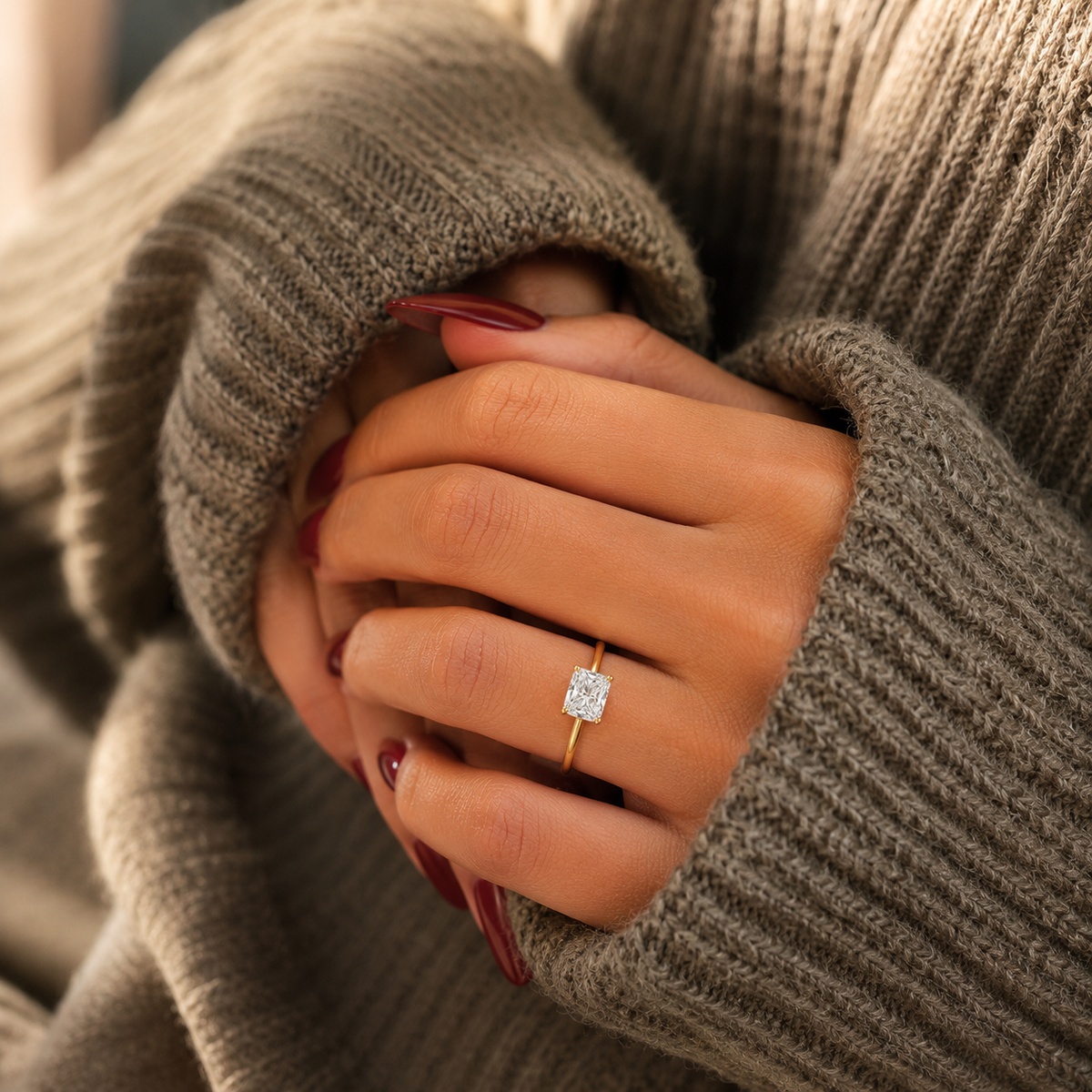 Elongated cushion-cut lab-grown diamond solitaire engagement ring lifestyle close-up