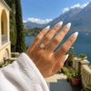 Elongated cushion-cut lab-grown diamond solitaire engagement ring worn on hand
