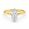 Front view of a marquise-cut lab-grown diamond hidden halo engagement ring in yellow gold