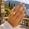 Marquise-cut lab-grown diamond hidden halo engagement ring worn on hand