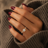 Oval-cut lab-grown diamond hidden halo pavé engagement ring lifestyle close-up