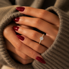 Oval-cut lab-grown diamond pavé solitaire engagement ring lifestyle close-up