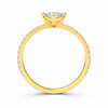 Angled view of an oval-cut lab-grown diamond pavé solitaire engagement ring in yellow gold