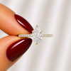 Close-up of a pear-cut lab-grown diamond pavé solitaire engagement ring in yellow gold