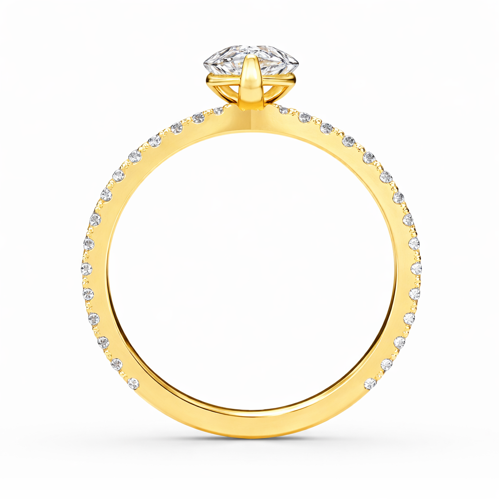 Angled view of a pear-cut lab-grown diamond pavé solitaire engagement ring in yellow gold