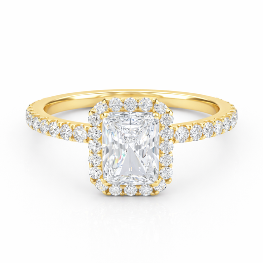 Front view of a radiant-cut lab-grown diamond halo pavé engagement ring in yellow gold