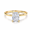 Front view of a radiant-cut lab-grown diamond hidden halo engagement ring in yellow gold