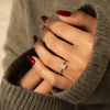 Radiant-cut lab-grown diamond hidden halo engagement ring worn on hand