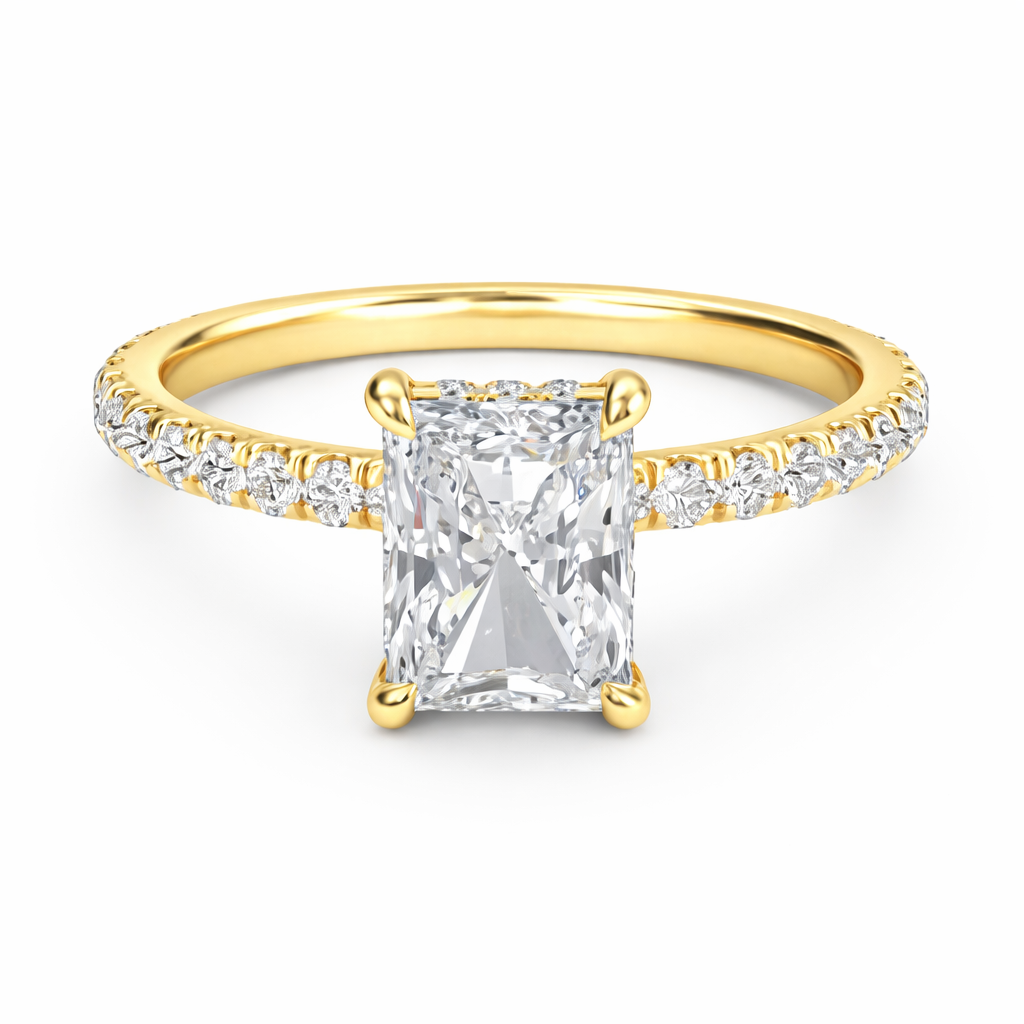 Front view of a radiant-cut lab-grown diamond hidden halo pavé engagement ring in yellow gold