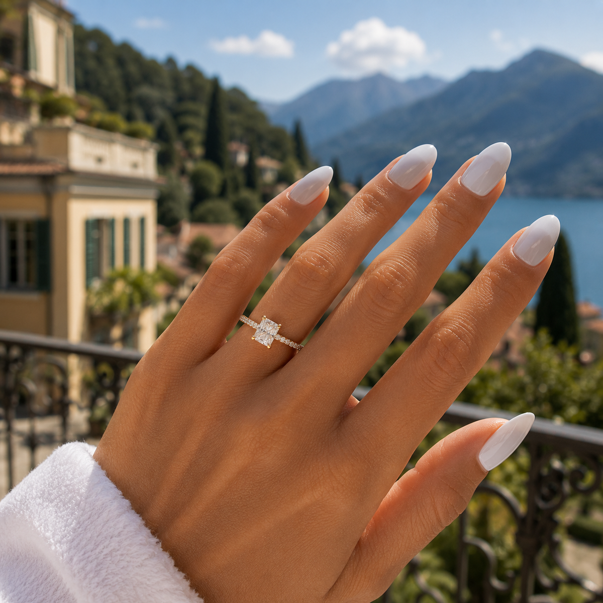 Radiant-cut lab-grown diamond hidden halo pavé engagement ring worn on hand